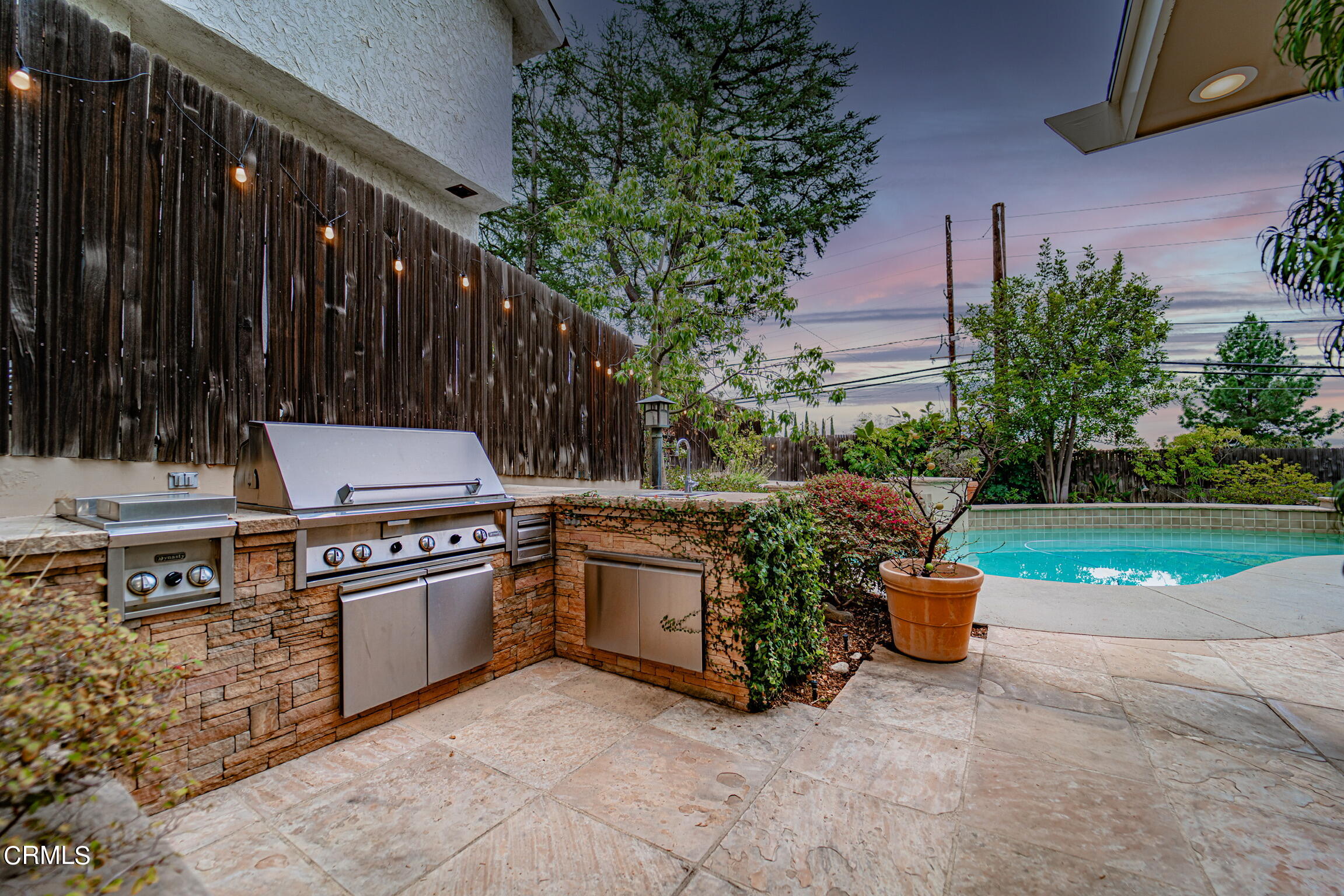 5212 Pizzo Ranch Road La Canada Flintridge, CA 91011 - Photo 35 of 44 a view of a backyard with potted plants and wooden fence