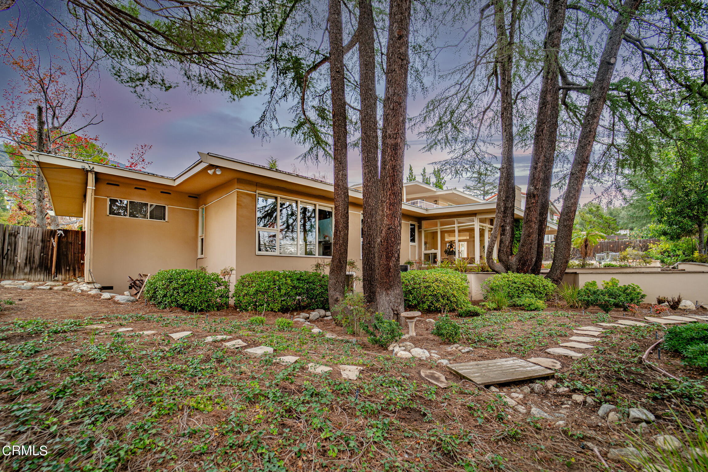5212 Pizzo Ranch Road La Canada Flintridge, CA 91011 - Photo 39 of 44 a front view of a house with a yard and outdoor seating