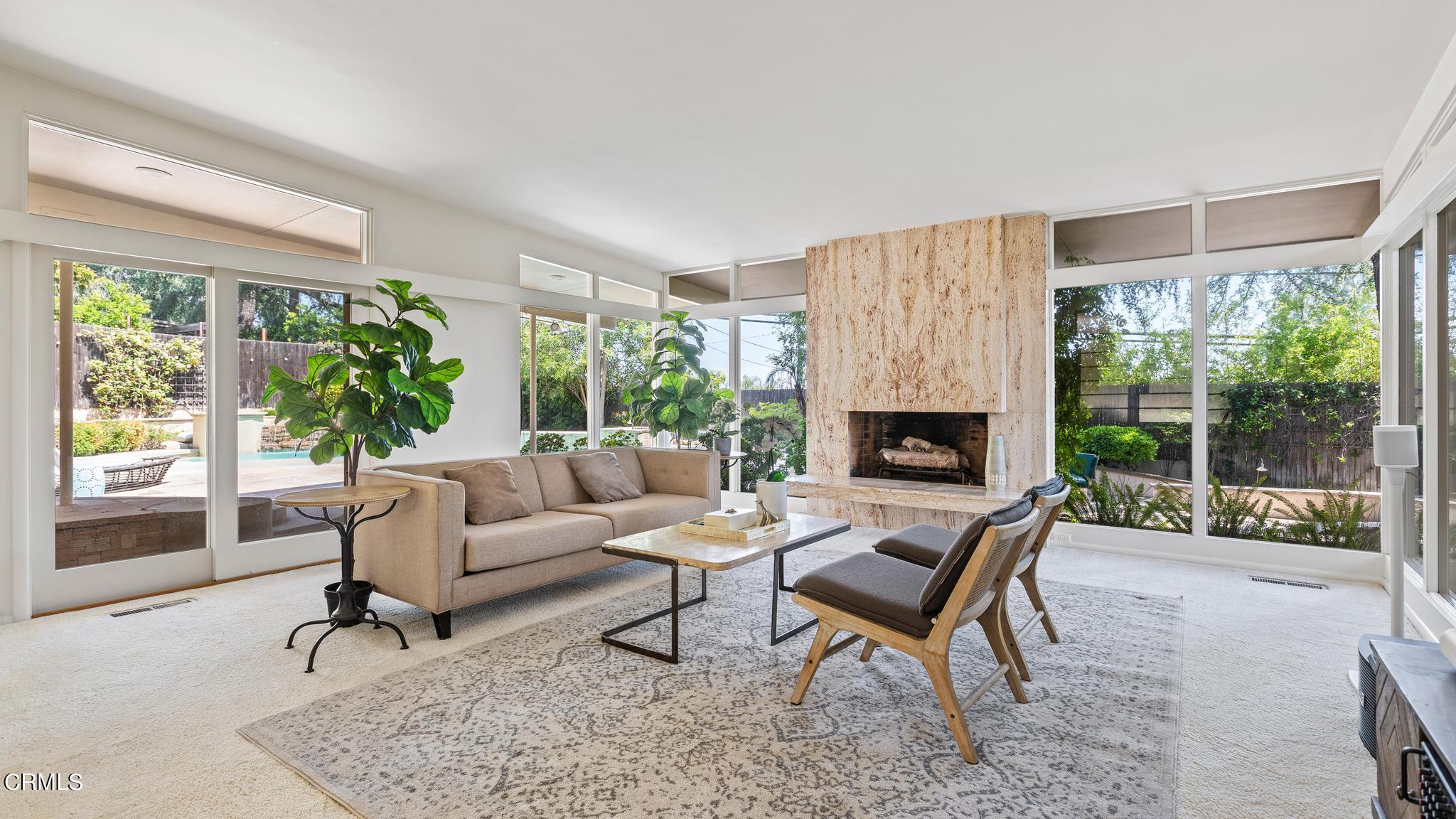 5212 Pizzo Ranch Road La Canada Flintridge, CA 91011 - Photo 6 of 44 a living room with furniture and a fireplace