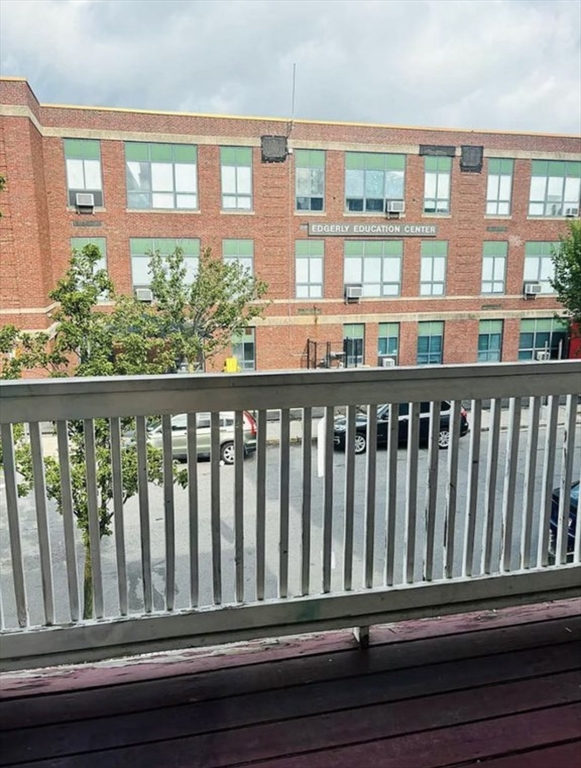 15 Ellsworth Street, Unit 2 Somerville, MA 02145 - Photo 14 of 16 a view of a balcony with wooden floor