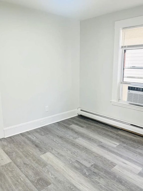 15 Ellsworth Street, Unit 2 Somerville, MA 02145 - Photo 10 of 16 an empty room with a window