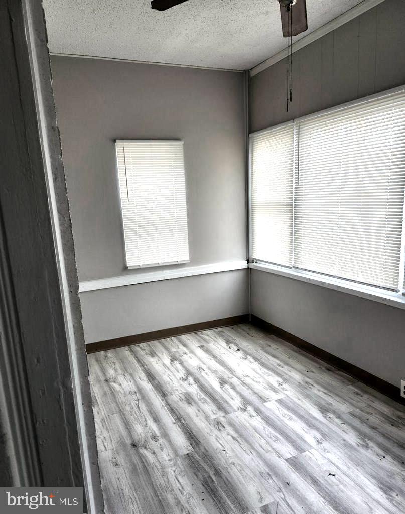 602 Powell Street Gloucester City, NJ 08030 - Photo 2 of 12 a view of an empty room and window