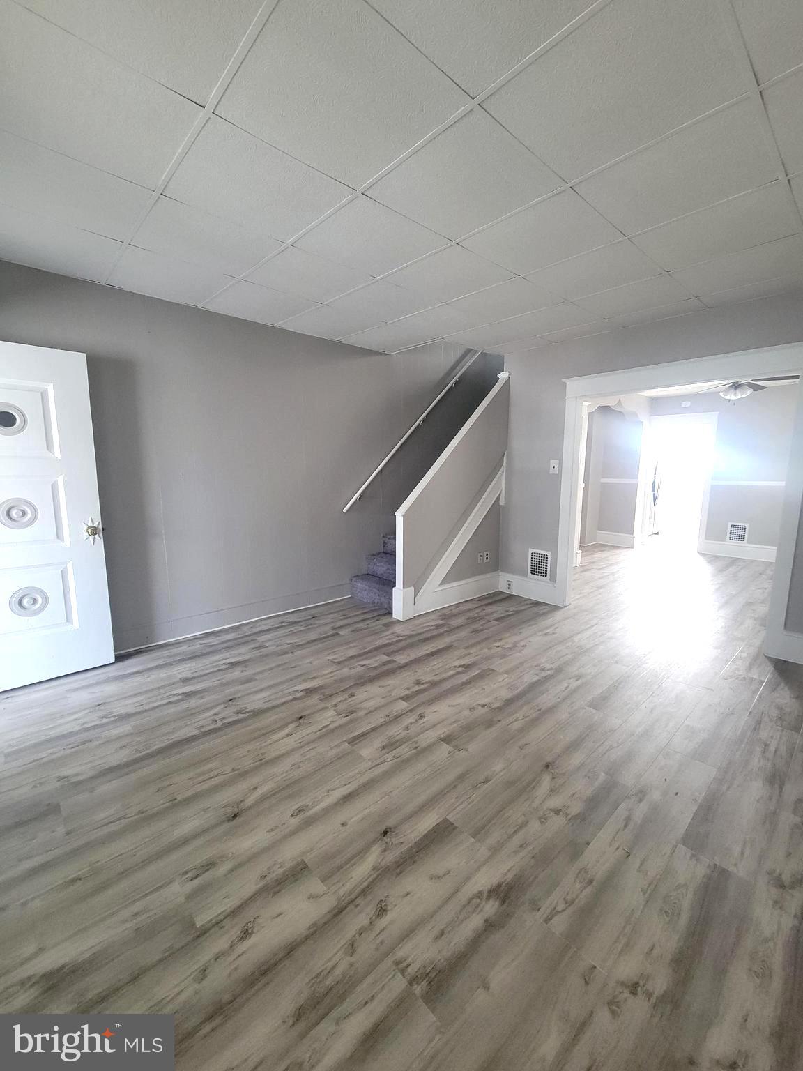 602 Powell Street Gloucester City, NJ 08030 - Photo 5 of 12 a view of empty room with wooden floor