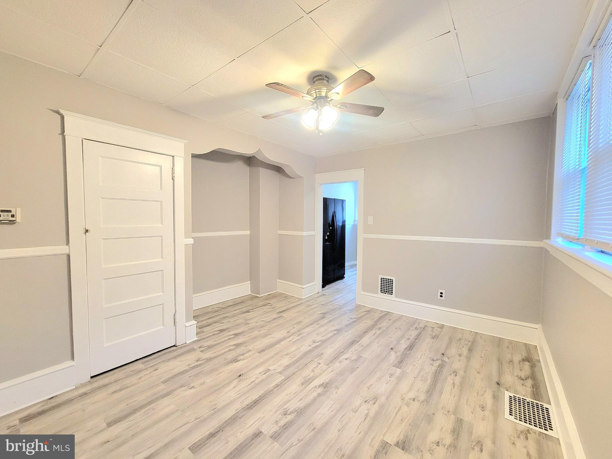 602 Powell Street Gloucester City, NJ 08030 - Photo 7 of 12 a view of an empty room with wooden floor