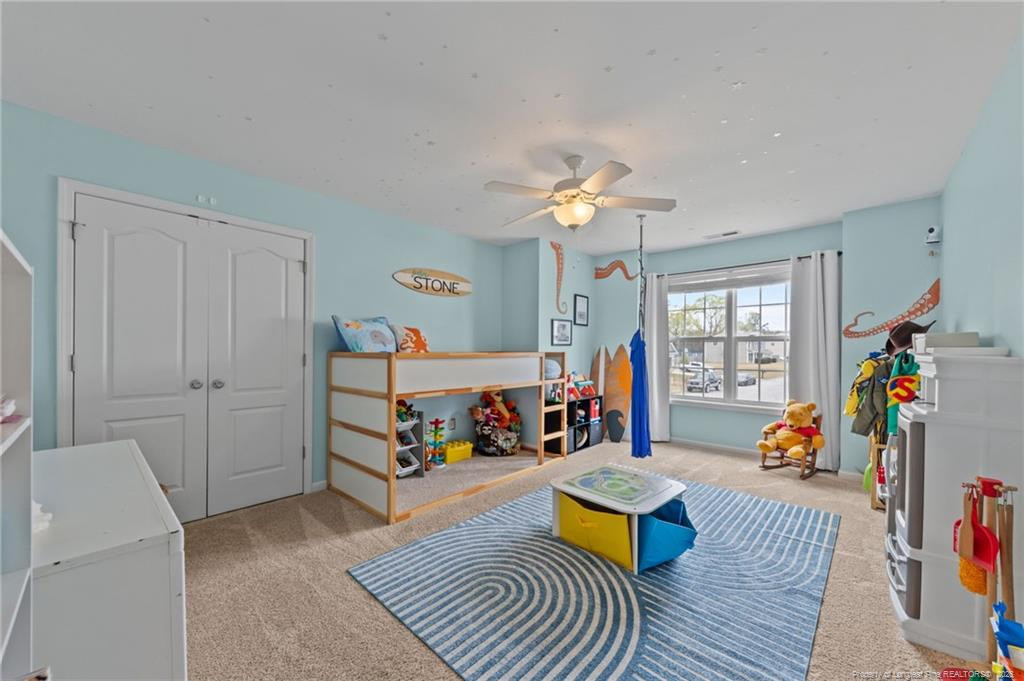 594 Allegiance Street Raeford, NC 28376 - Photo 21 of 49 a living room with furniture and a wooden floor