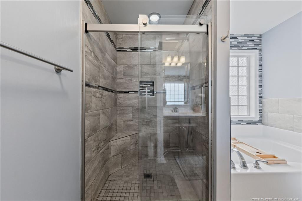 594 Allegiance Street Raeford, NC 28376 - Photo 28 of 49 a bathroom with a shower