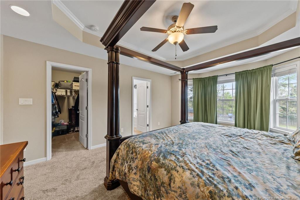 594 Allegiance Street Raeford, NC 28376 - Photo 30 of 49 a bedroom with a large bed and a large window