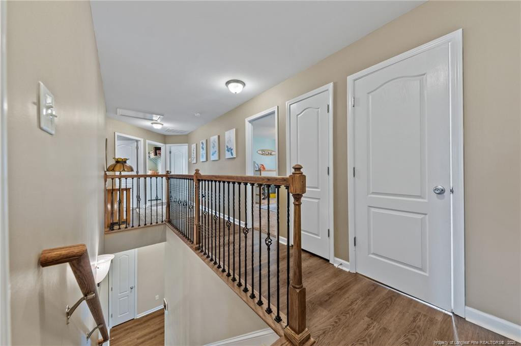 594 Allegiance Street Raeford, NC 28376 - Photo 31 of 49 a view of a hallway with wooden floor and windows