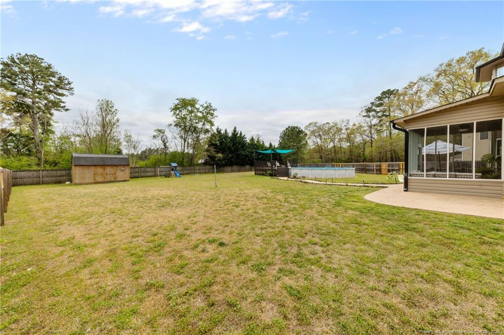 594 Allegiance Street Raeford, NC 28376 - Photo 33 of 49 a view of a swimming pool with an outdoor space and seating area