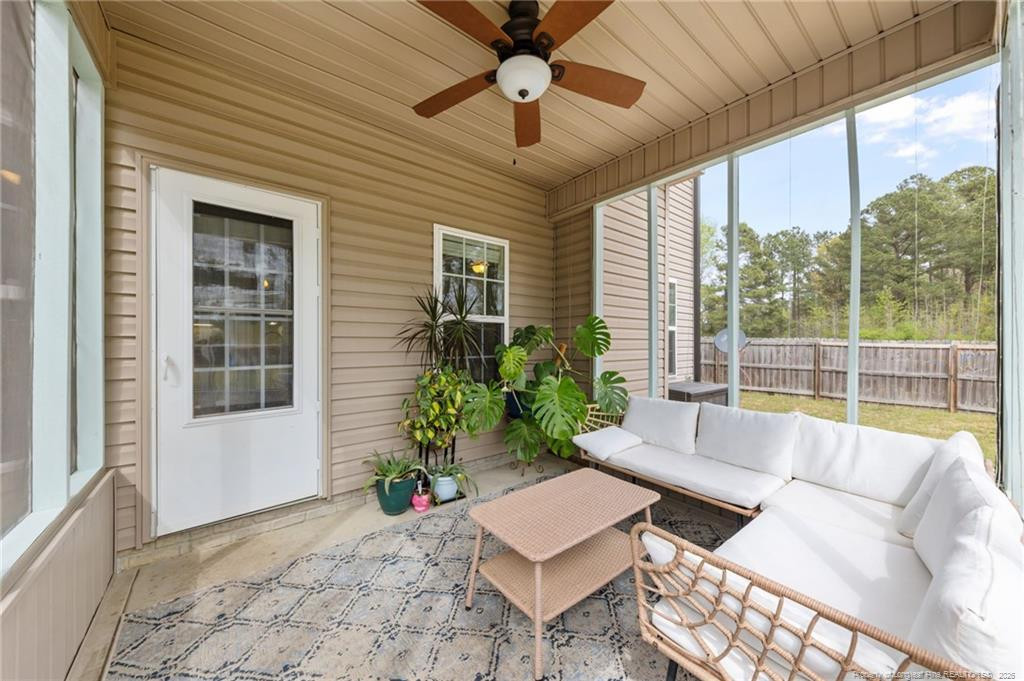 594 Allegiance Street Raeford, NC 28376 - Photo 39 of 49 a living room with furniture and a potted plant