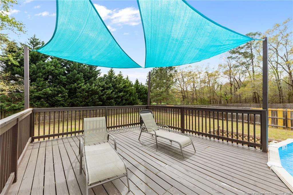 594 Allegiance Street Raeford, NC 28376 - Photo 42 of 49 a view of balcony with wooden floor and outdoor seating