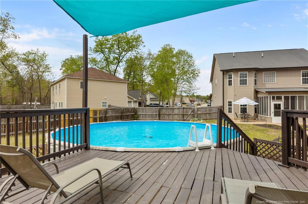 594 Allegiance Street Raeford, NC 28376 - Photo 43 of 49 a view of a balcony with wooden floor and pool table and chairs