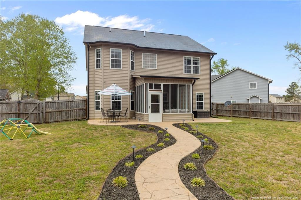 594 Allegiance Street Raeford, NC 28376 - Photo 45 of 49 a view of a house with swimming pool and porch