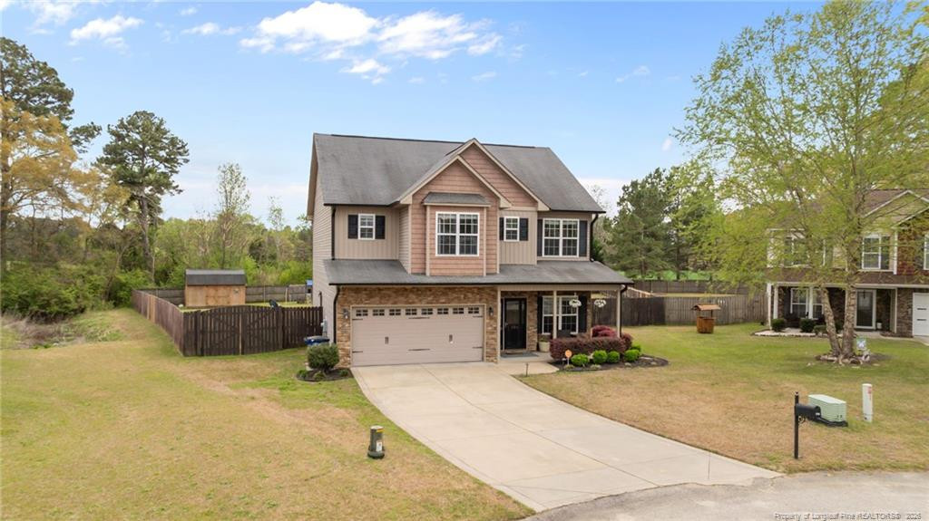 594 Allegiance Street Raeford, NC 28376 - Photo 46 of 49 a front view of a house with a yard