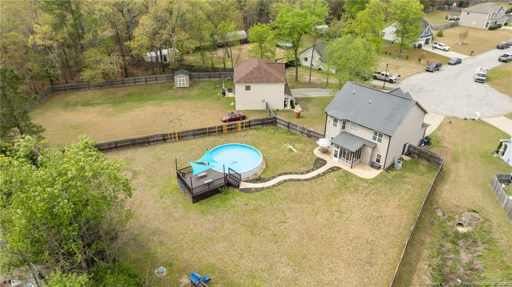 594 Allegiance Street Raeford, NC 28376 - Photo 48 of 49 an aerial view of a house with swimming pool and large trees