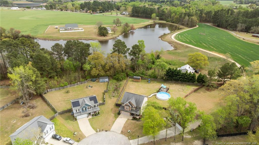 594 Allegiance Street Raeford, NC 28376 - Photo 49 of 49 a view of a lake with a yard