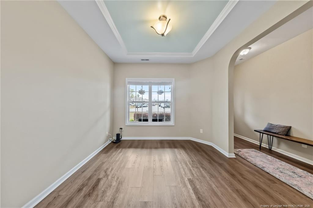 594 Allegiance Street Raeford, NC 28376 - Photo 6 of 49 wooden floor in an empty room with a window