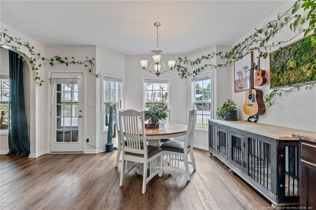 594 Allegiance Street Raeford, NC 28376 - Photo 8 of 49 a view of a dining room with furniture window and wooden floor