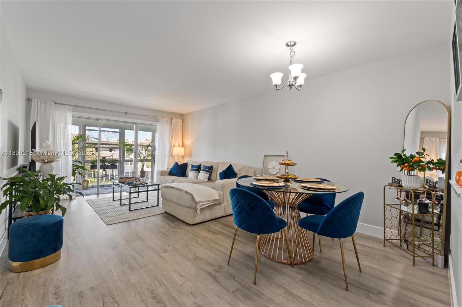 1501 South Ocean Boulevard, Unit 318 Lauderdale-by-the-Sea, FL 33062 - Photo 14 of 26 a view of a dining room with furniture window and wooden floor