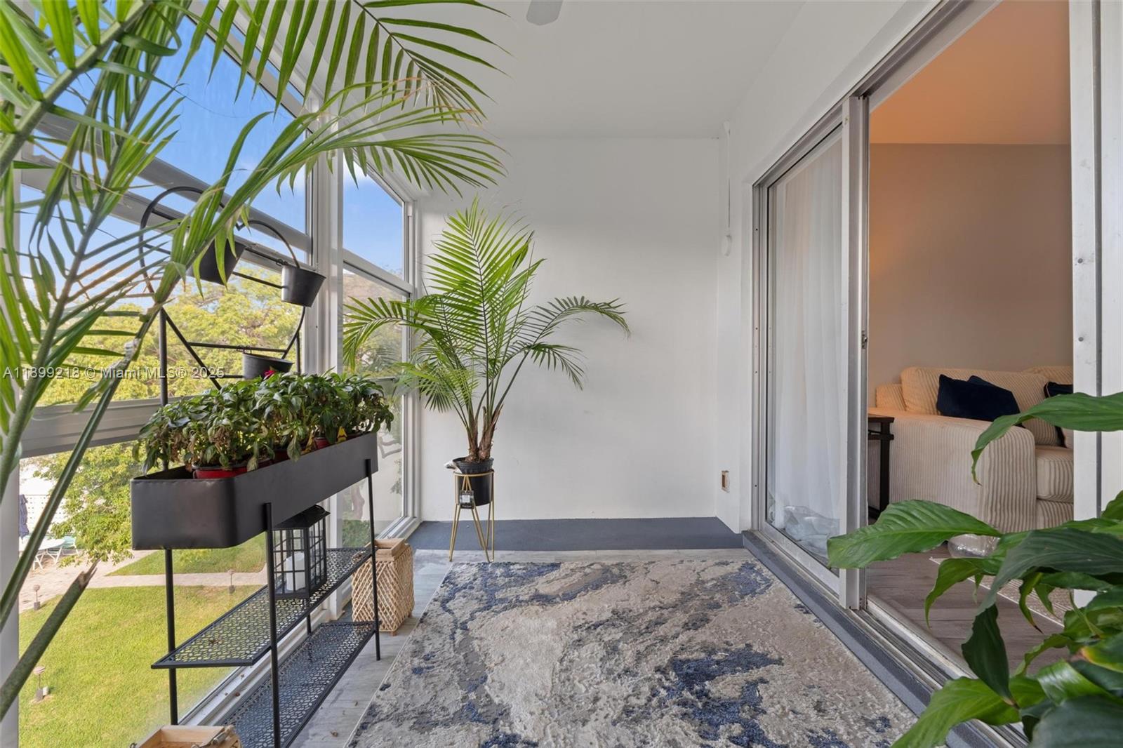 1501 South Ocean Boulevard, Unit 318 Lauderdale-by-the-Sea, FL 33062 - Photo 20 of 26 a view of a backyard with a potted plant