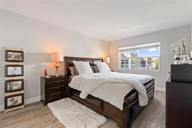 a bedroom with a bed window and a book shelf