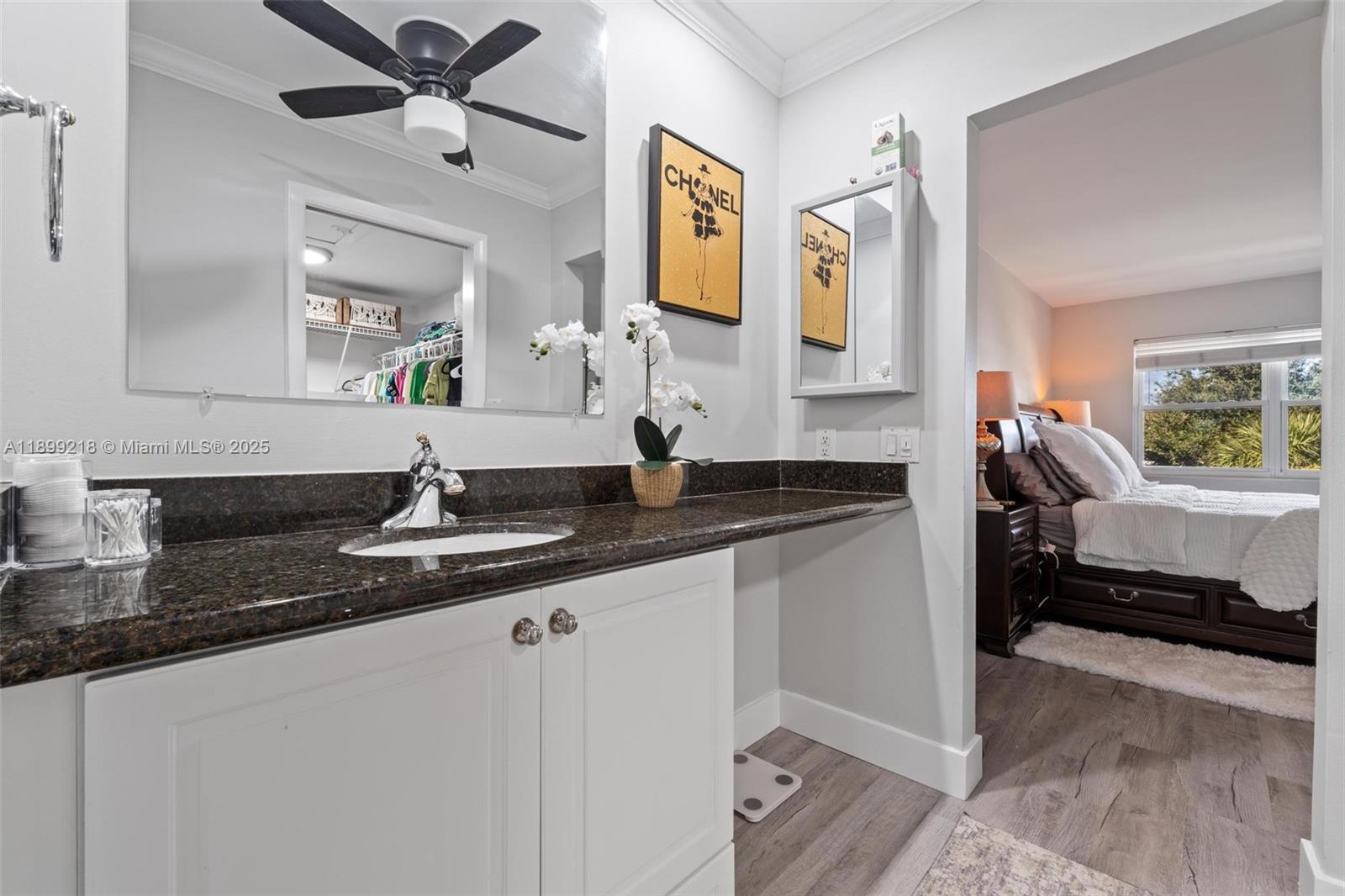 1501 South Ocean Boulevard, Unit 318 Lauderdale-by-the-Sea, FL 33062 - Photo 25 of 26 a en suite bathroom with a granite countertop sink and a mirror