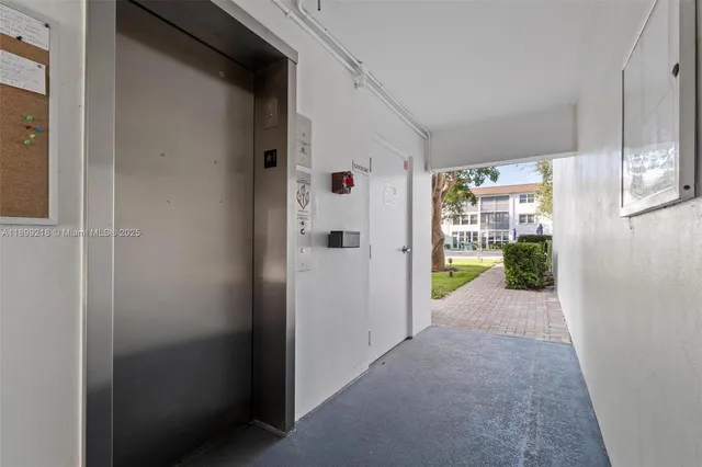 a view of a hallway with a dining area