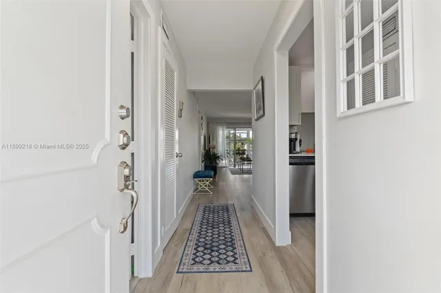 a view of a hallway with a white walls