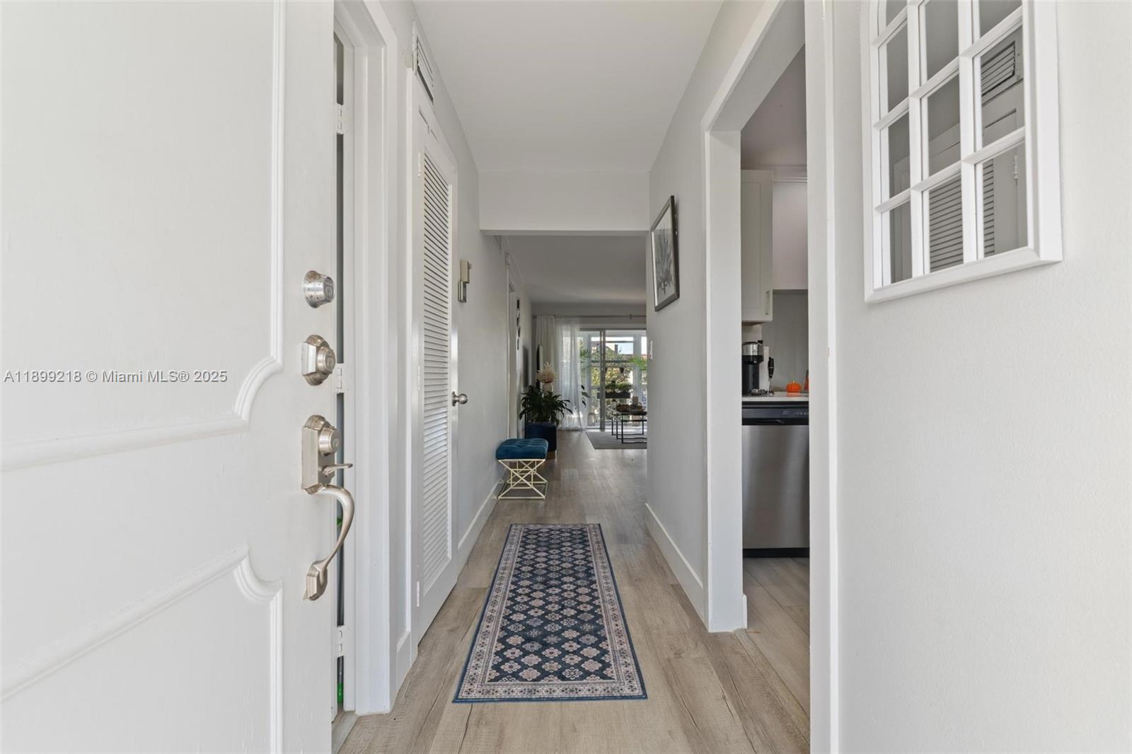1501 South Ocean Boulevard, Unit 318 Lauderdale-by-the-Sea, FL 33062 - Photo 8 of 26 a view of a hallway with a white walls