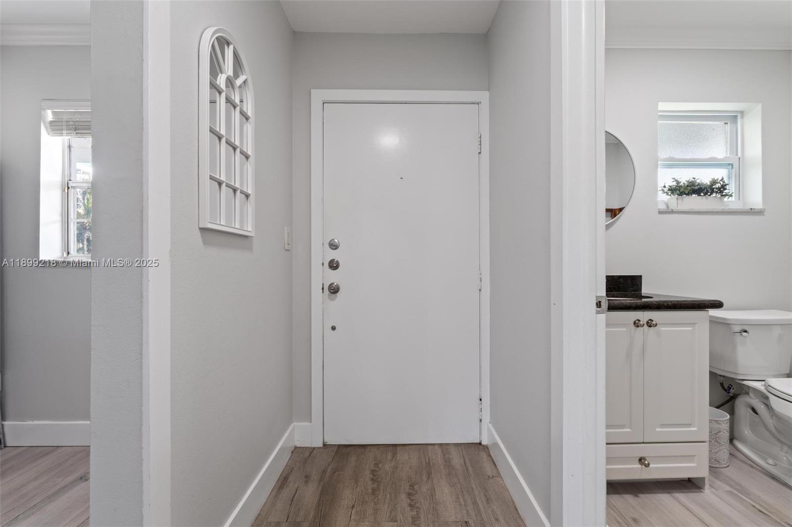 1501 South Ocean Boulevard, Unit 318 Lauderdale-by-the-Sea, FL 33062 - Photo 9 of 26 a view of hallway with wooden floor