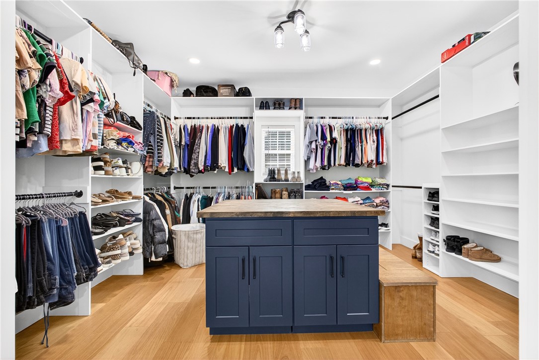 5016 Copeland Road Belton, SC 29627 - Photo 20 of 45 Ample storage solutions and a central island define this well-appointed walk-in closet.
