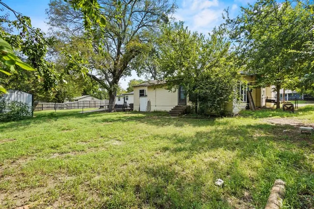 a view of a backyard with a garden