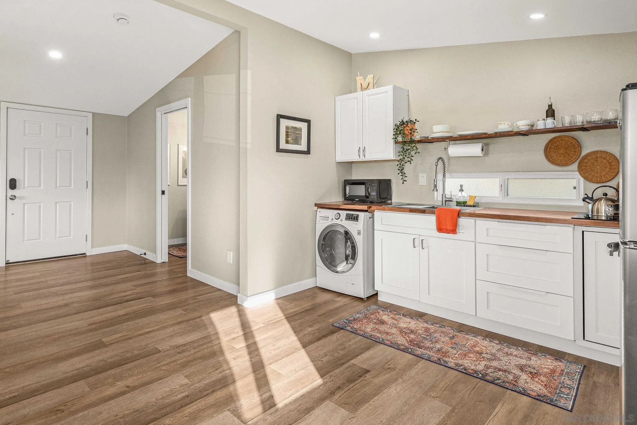 6081 Horton Drive, Unit CASITA La Mesa, CA 91942 - Photo 11 of 30 a utility room with cabinets washer and dryer