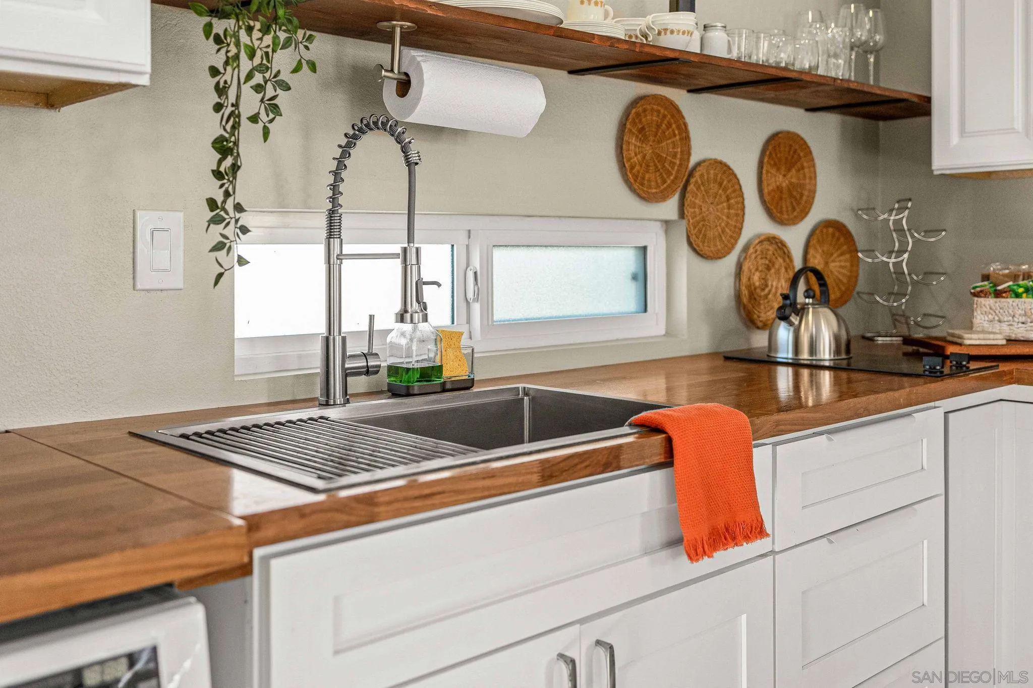 6081 Horton Drive, Unit CASITA La Mesa, CA 91942 - Photo 13 of 30 a kitchen with a sink and a stove