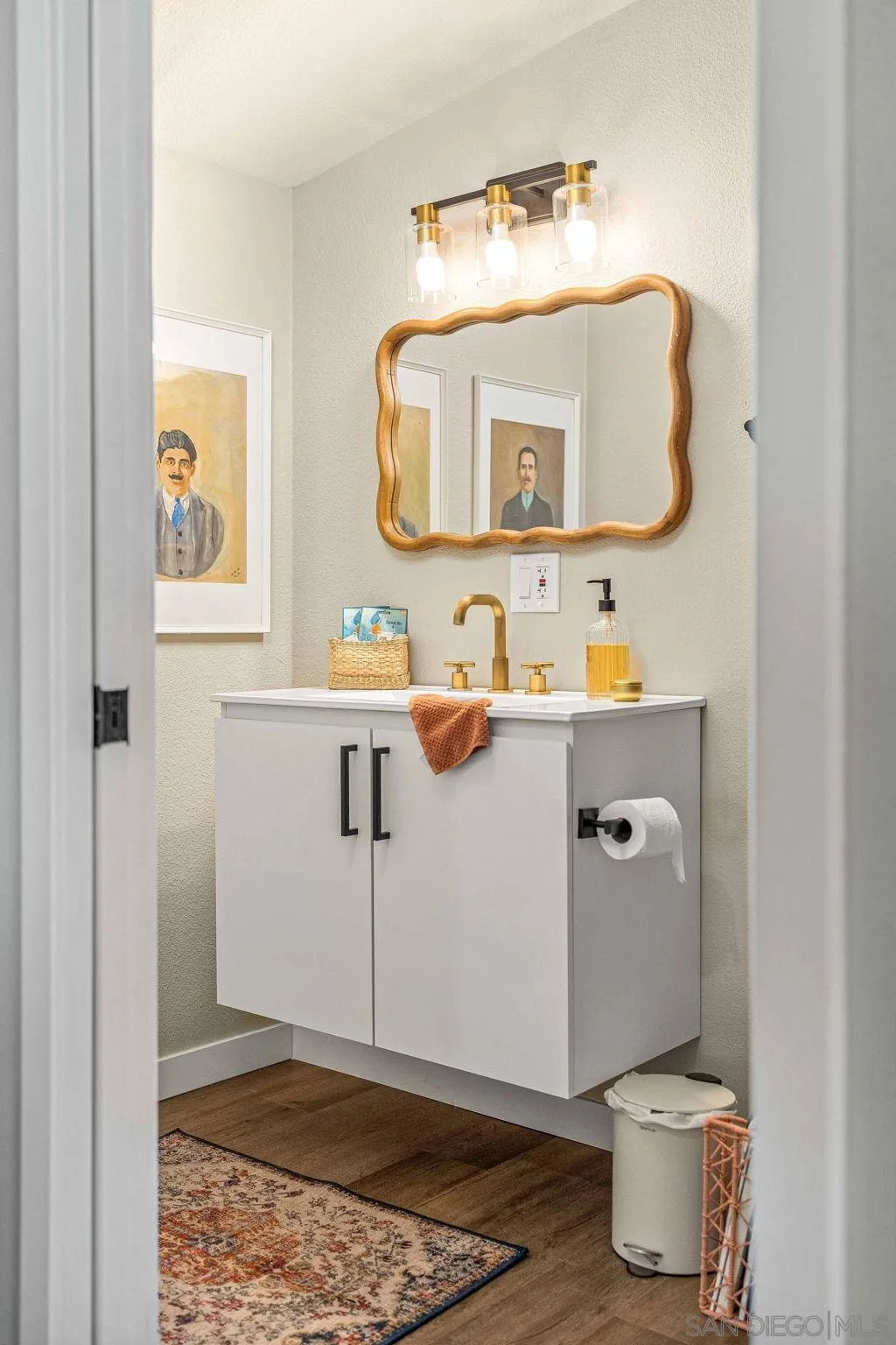 6081 Horton Drive, Unit CASITA La Mesa, CA 91942 - Photo 15 of 30 a bathroom with a sink toilet and mirror