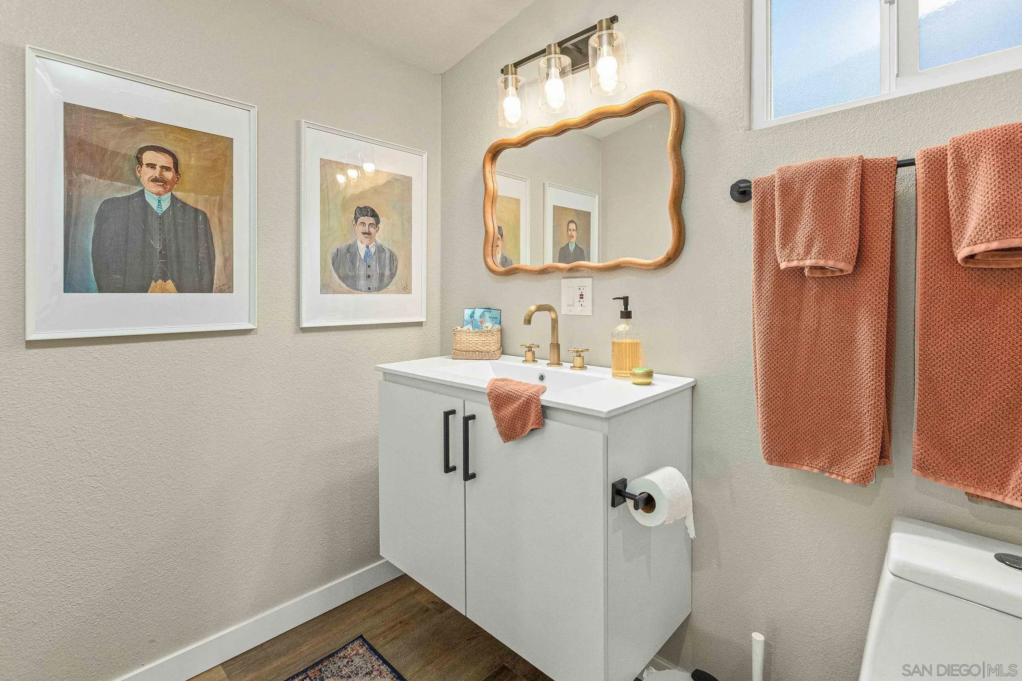 6081 Horton Drive, Unit CASITA La Mesa, CA 91942 - Photo 16 of 30 a bathroom with a sink vanity and mirror