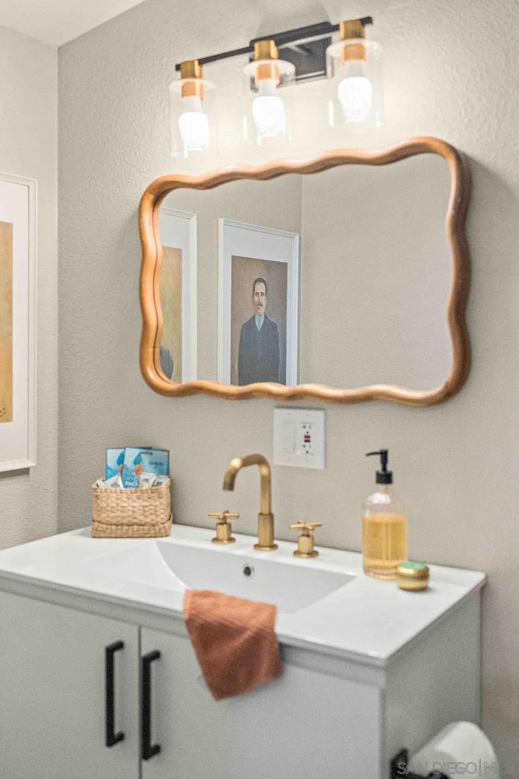 6081 Horton Drive, Unit CASITA La Mesa, CA 91942 - Photo 17 of 30 a bathroom with a sink mirror and vanity