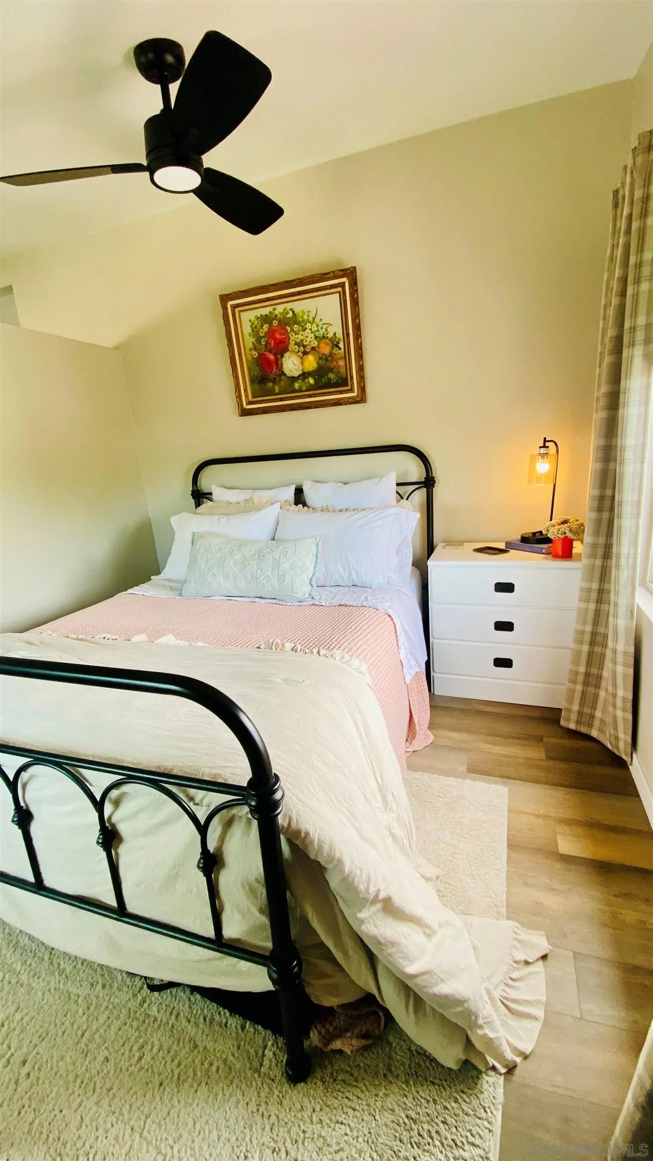 6081 Horton Drive, Unit CASITA La Mesa, CA 91942 - Photo 23 of 30 a bedroom with a bed and painting on the wall