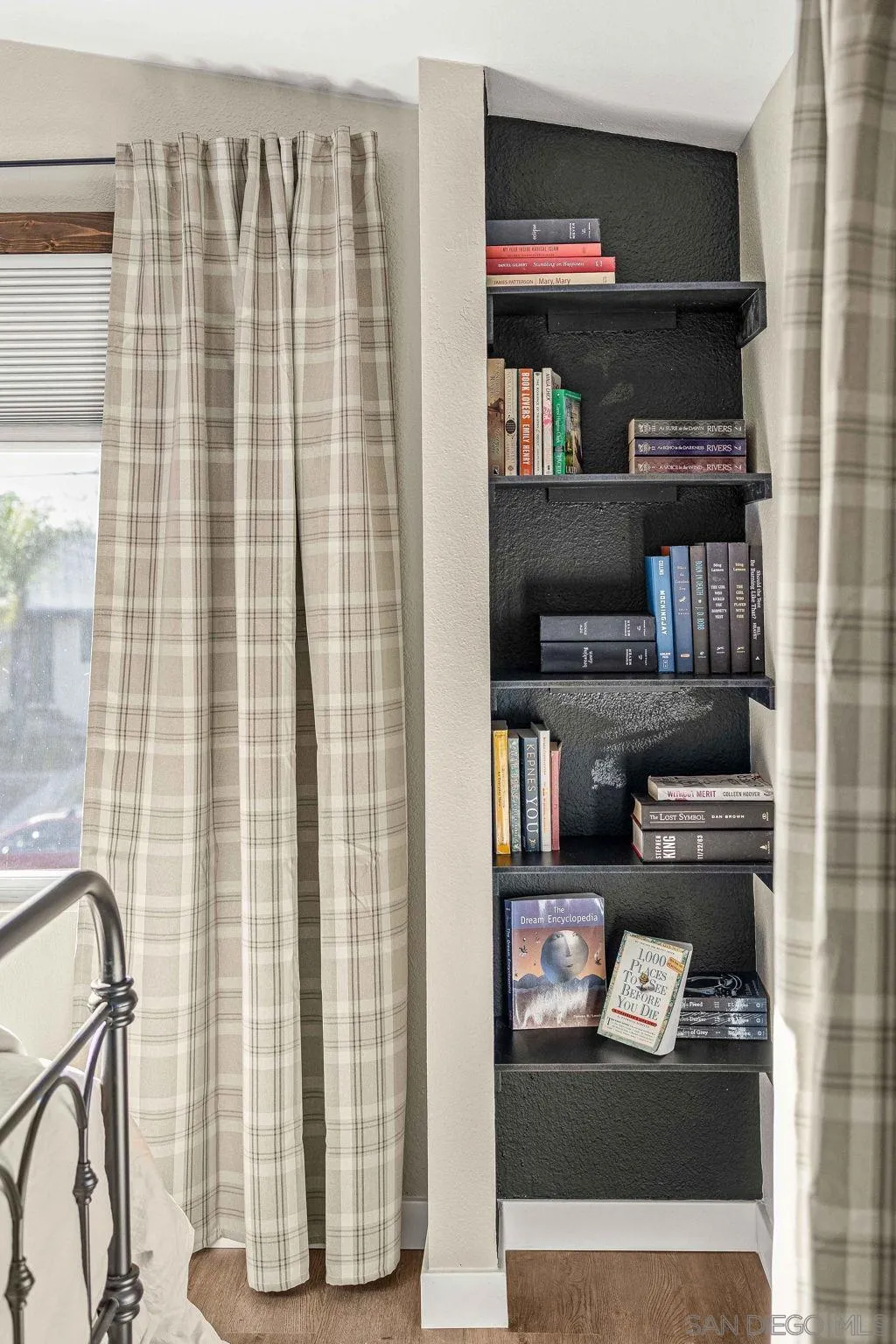 6081 Horton Drive, Unit CASITA La Mesa, CA 91942 - Photo 24 of 30 a shelf with books and knick knacks on it