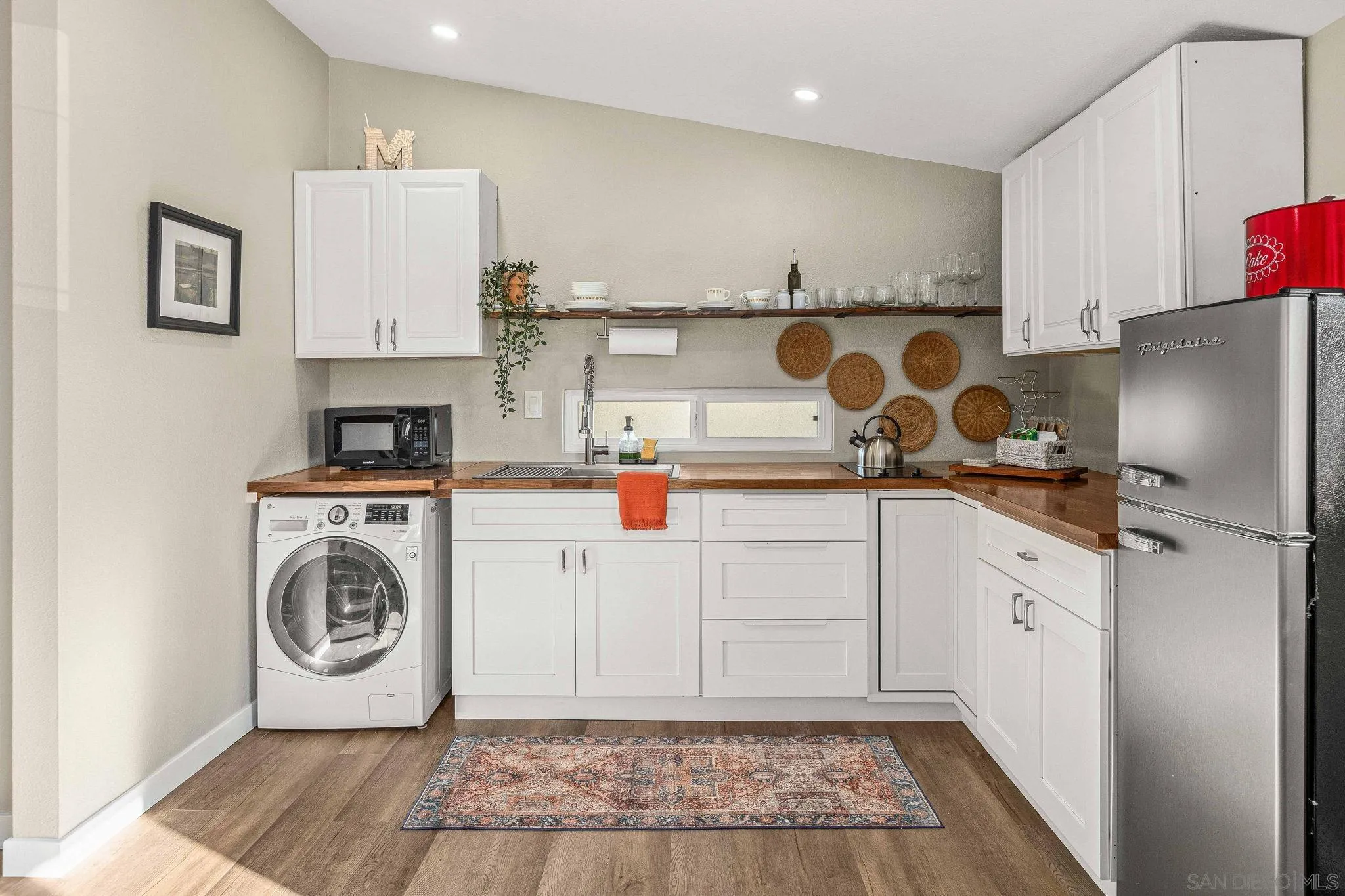 6081 Horton Drive, Unit CASITA La Mesa, CA 91942 - Photo 9 of 30 a kitchen with stainless steel appliances granite countertop a refrigerator and a stove