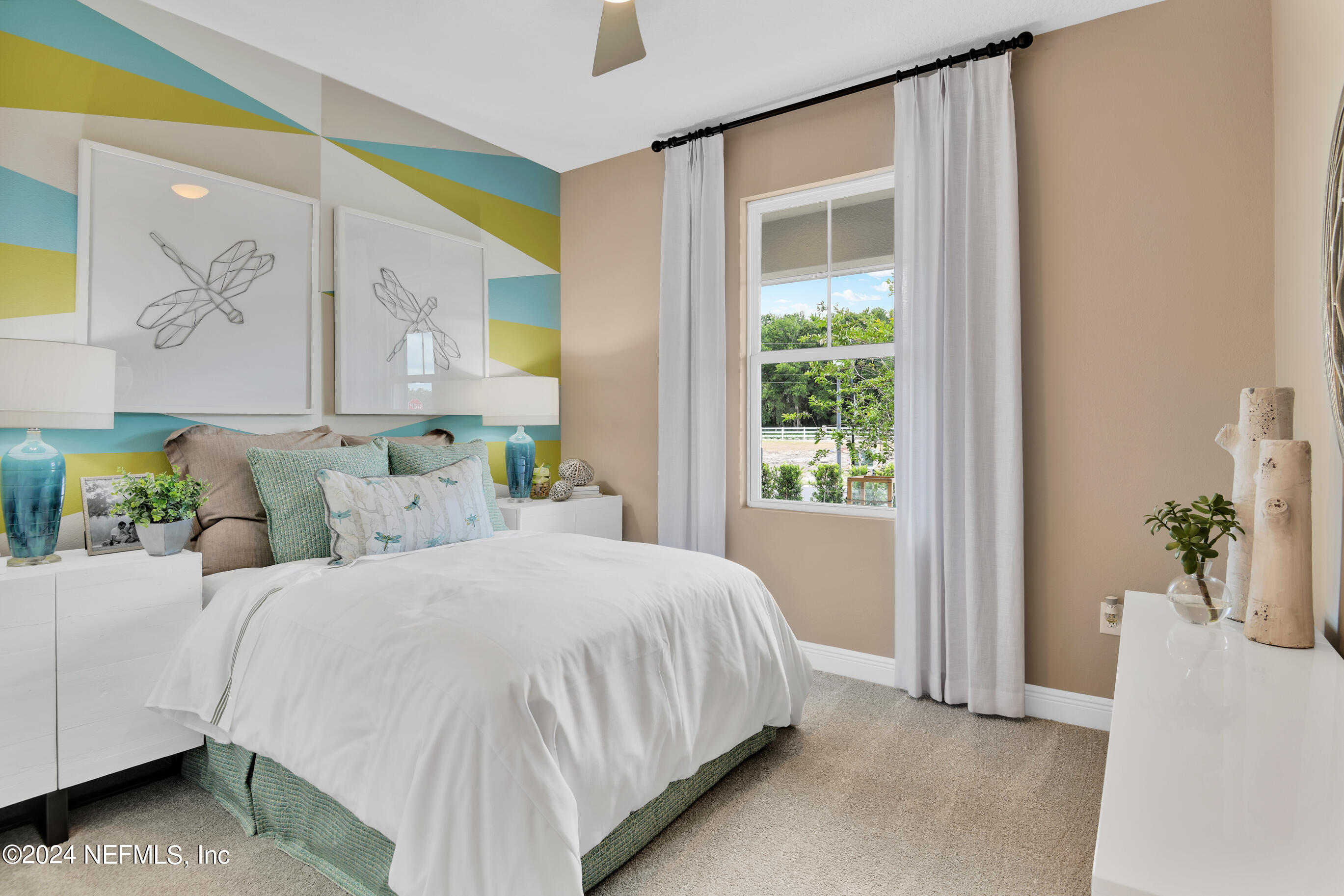 146 Arbor Alcove Lane St. Augustine, FL 32084 - Photo 13 of 18 a bedroom with a bed table and a window