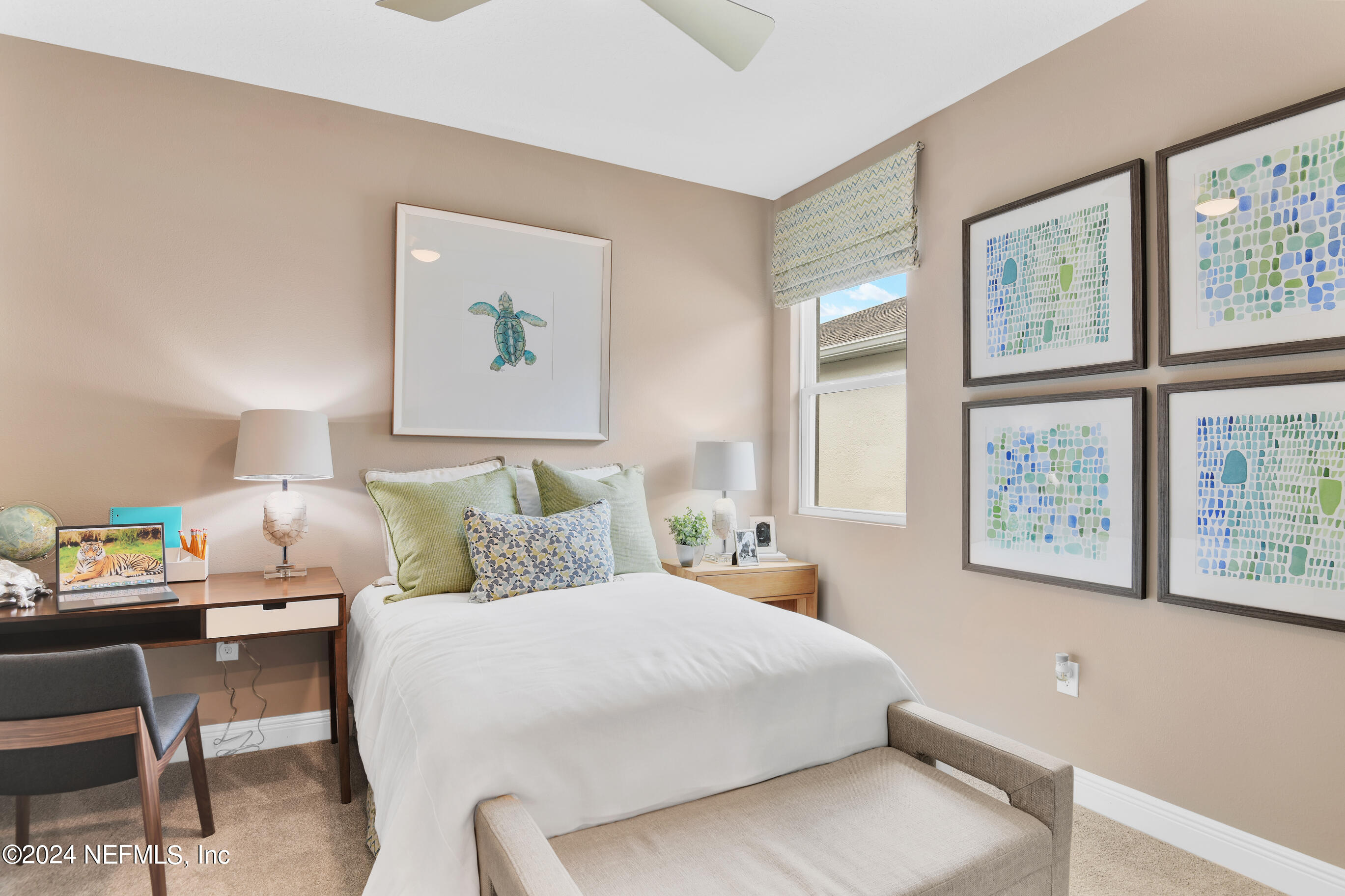 146 Arbor Alcove Lane St. Augustine, FL 32084 - Photo 10 of 18 a bedroom with a bed a painting on the wall and a window