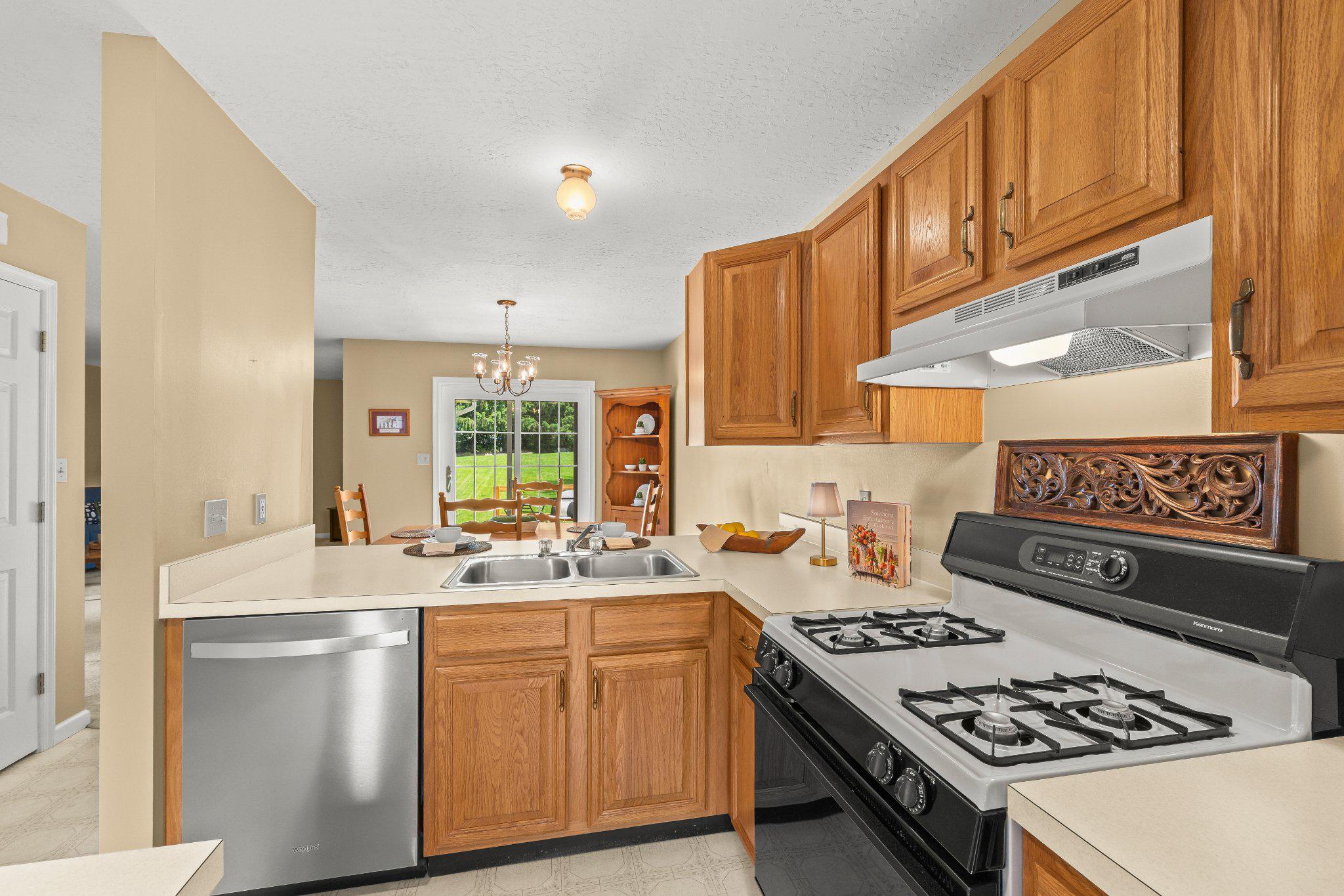443 Crosswinds Drive Lititz, PA 17543 - Photo 5 of 26 a kitchen with a stove a sink and a refrigerator