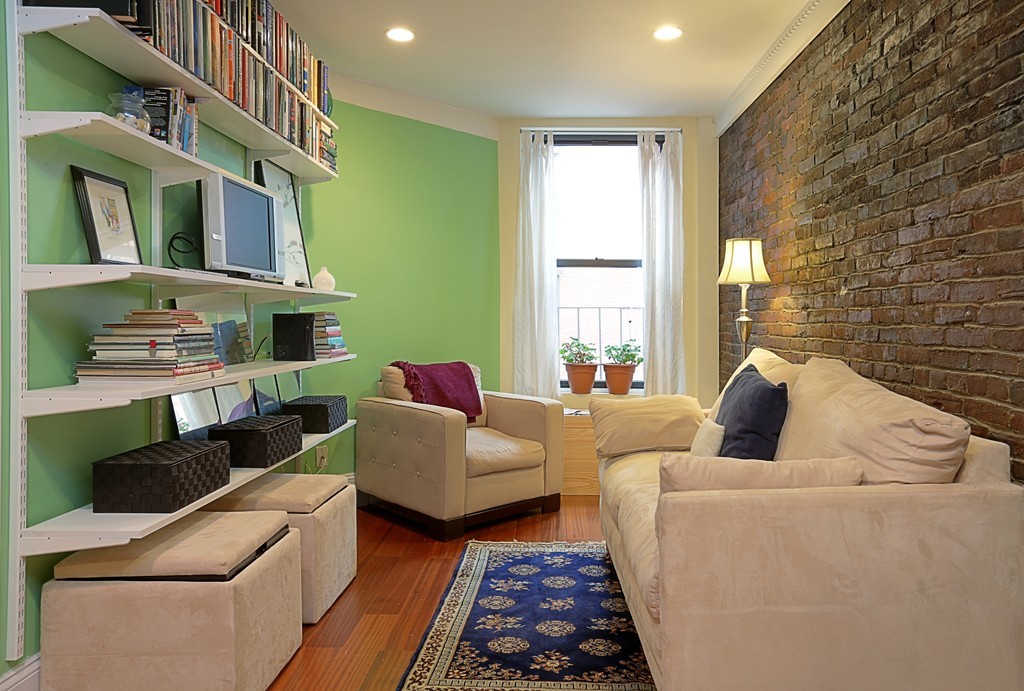 497 Beacon Street, Unit 9 Boston, MA 02215 - Photo 1 of 5 a living room with furniture fireplace and a window