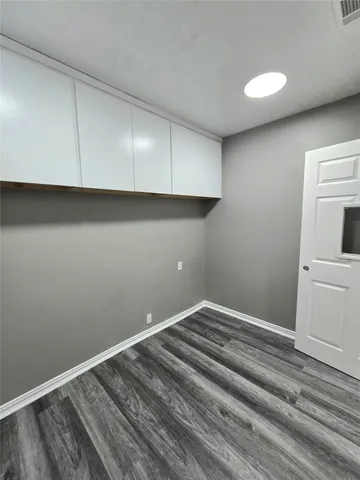 a bathroom with a sink a toilet a mirror and vanity