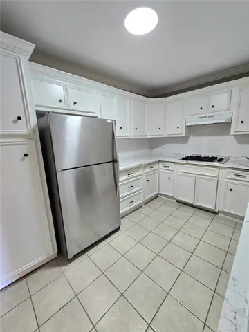 a bathroom with a sink mirror and toilet