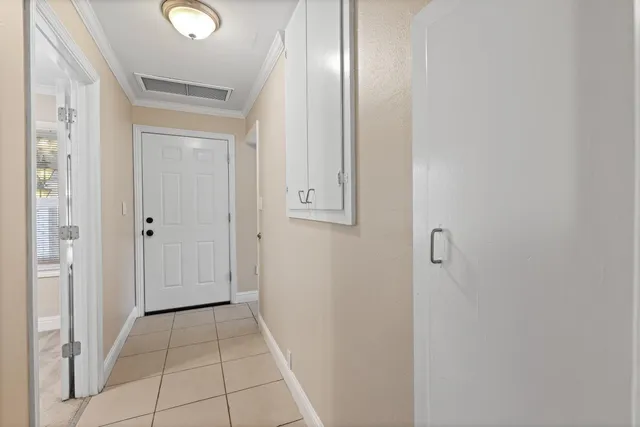 an aerial view of a house with outdoor space and a lake view