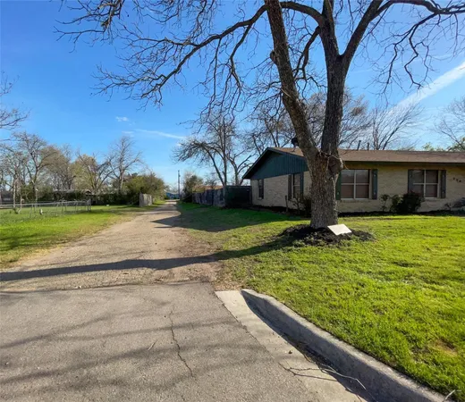 a view of a house with garden in front of it