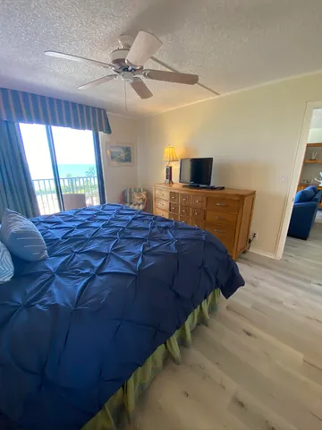 a bedroom with a bed and a table