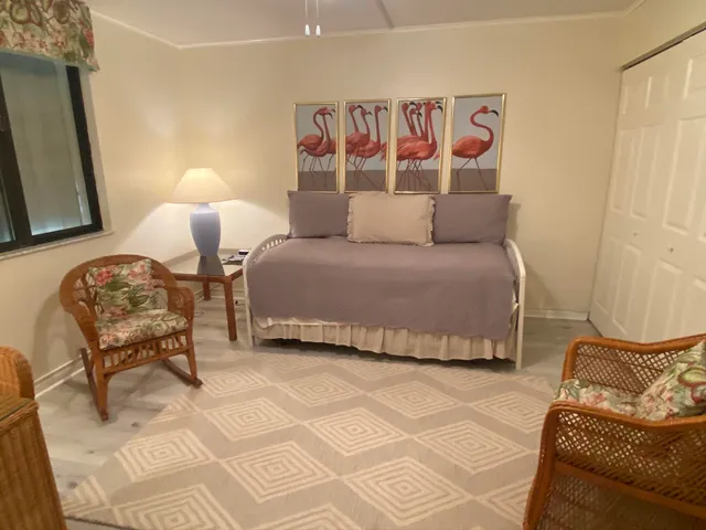 a bedroom with a bed and a mirror